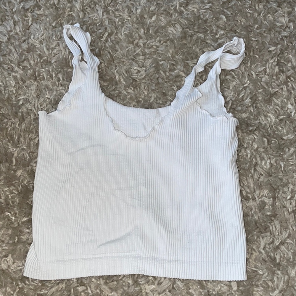 White tank top/ crop top. Small ruffles at the top and lined fabric.